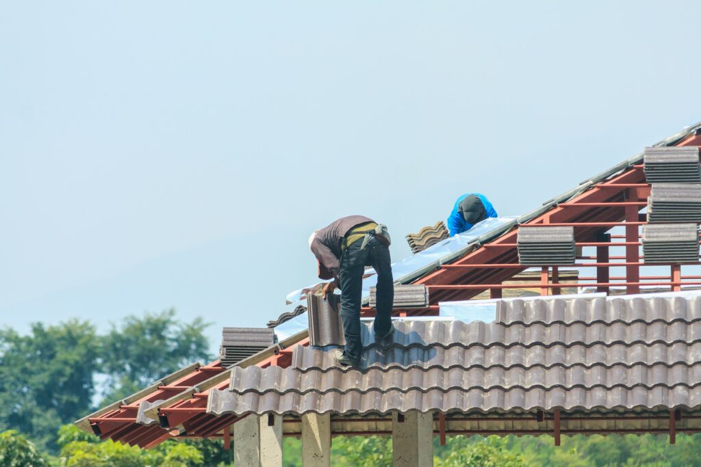 worker-installing-roof-tiles-min